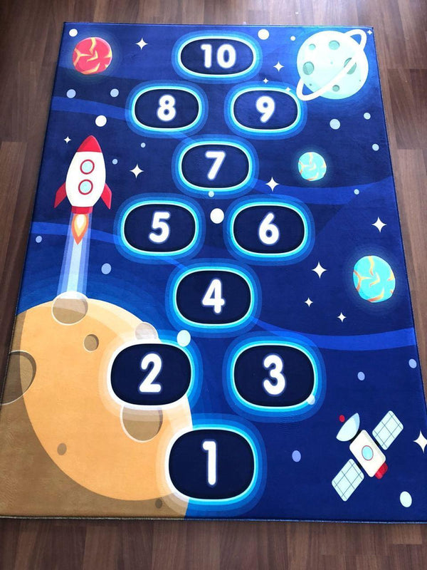 Colorful children's carpet with a space theme, featuring numbers and rocket designs, perfect for playrooms.