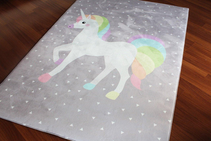 Soft children's carpet featuring a colorful unicorn design on a light gray background. Ideal for kids' rooms.