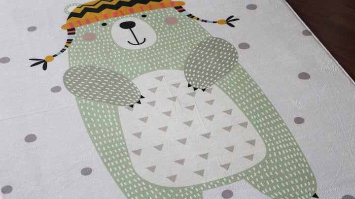 Children's carpet featuring a cute green bear design with playful patterns, perfect for a cozy room.